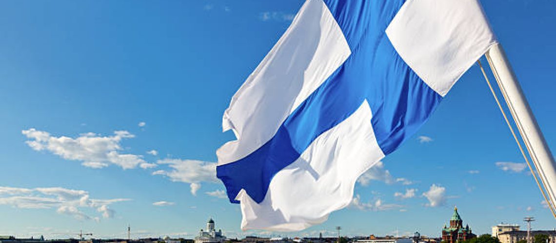 Flag of Finland against Helsinki panorama